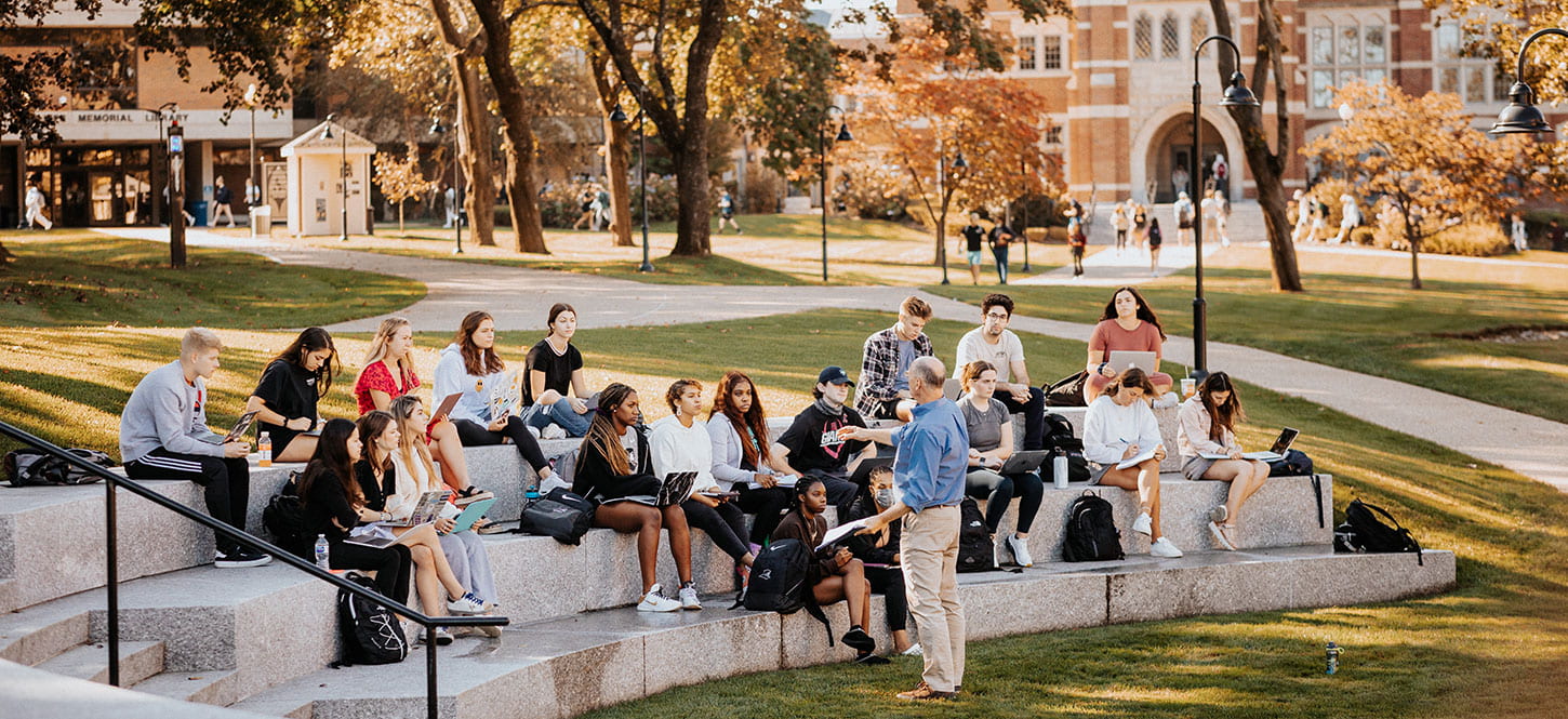 Dr.  Robert Hackey, Professor of Health Policy Management teaching in an outside classroom 